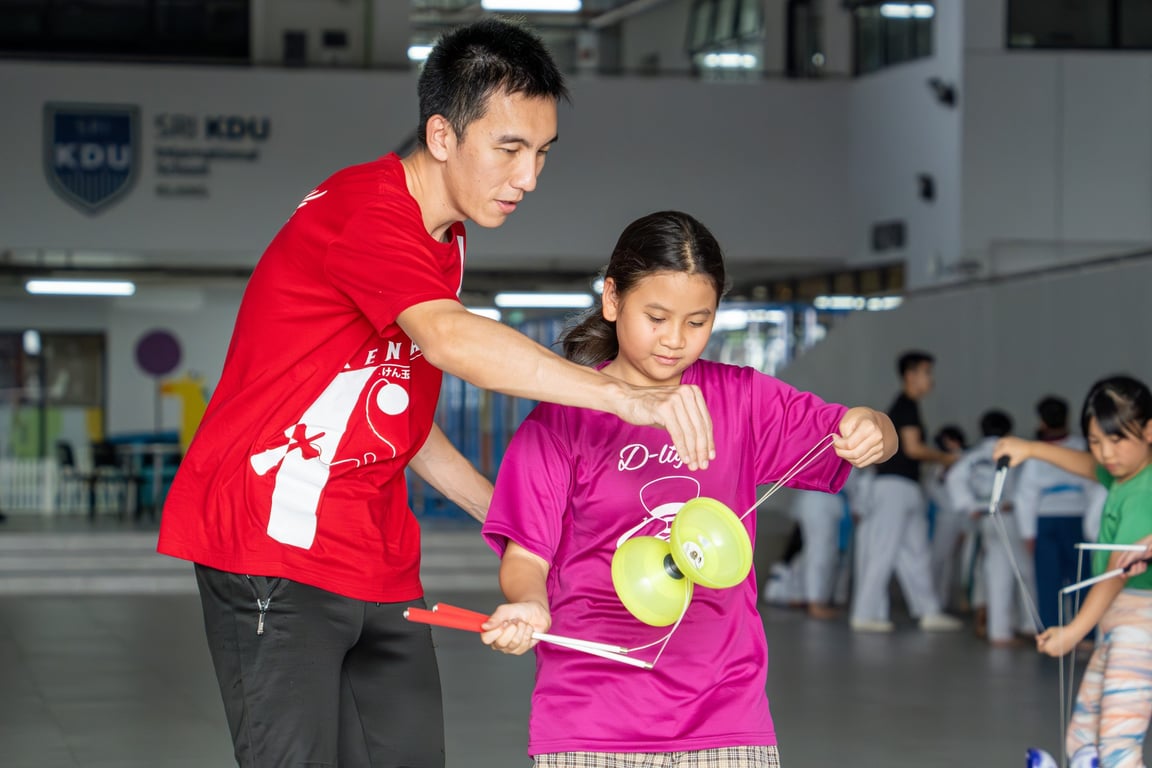 Students take on their Diabolo CCA, a traditional Chinese spinning-top activity that improves their hand-eye coordination, patience, focus, and creativity.