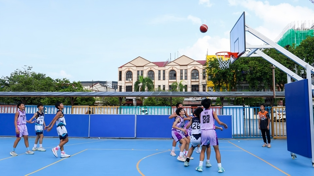 Students enjoying basketball practice during a Saturday sports session.