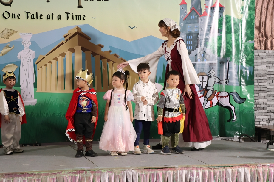 Young learners perform in a themed stage play.