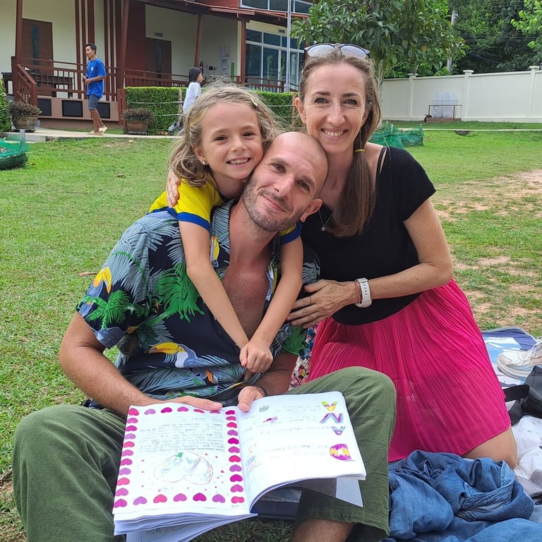 A family posing together at the Year-End event.