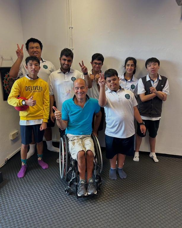 Mr. Gregory Burns, an internationally renowned artist, Paralympic swimmer, and motivational speaker, visited The Guild to engage with students