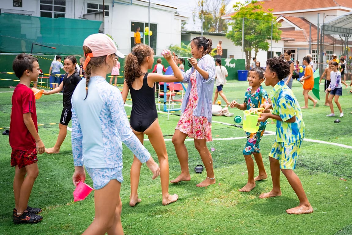 Students celebrating Songkran with water games.