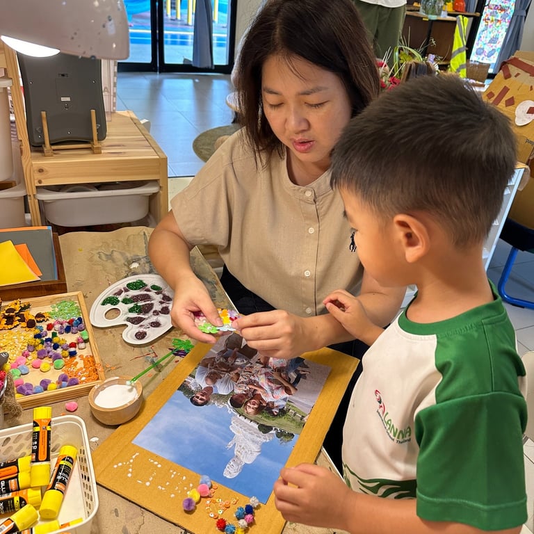 Parent and child working together during a Nursery student-led conference.