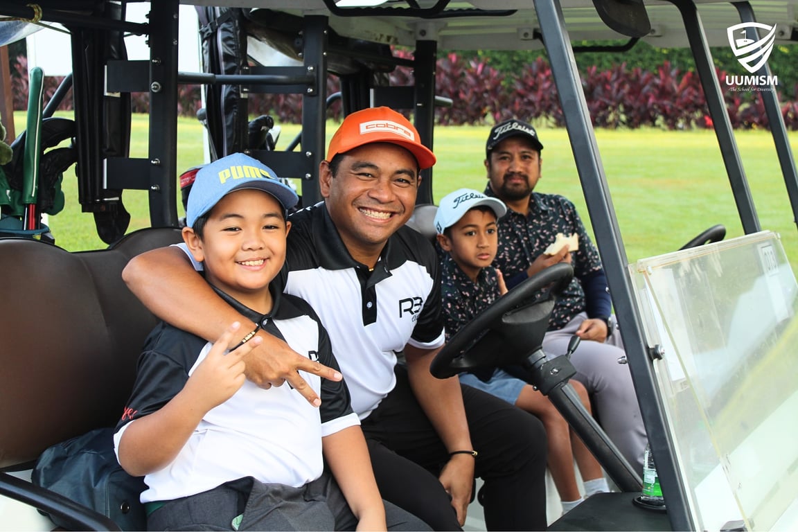 Families and students enjoy the day at the golf course.