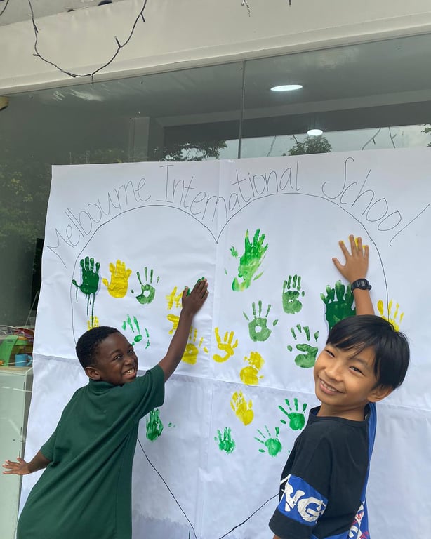 Students creating a decoration for Children's Day at MIS