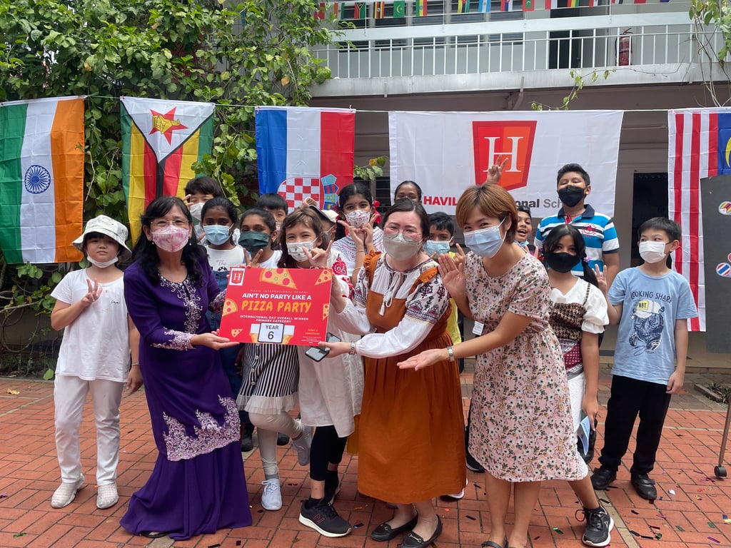 Year 6 celebrating International Day with teachers, parents, and friends.