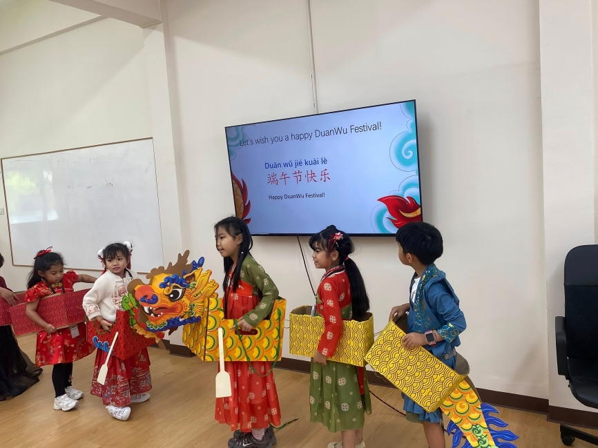 Children present a dragon dance for Duanwu Festival.