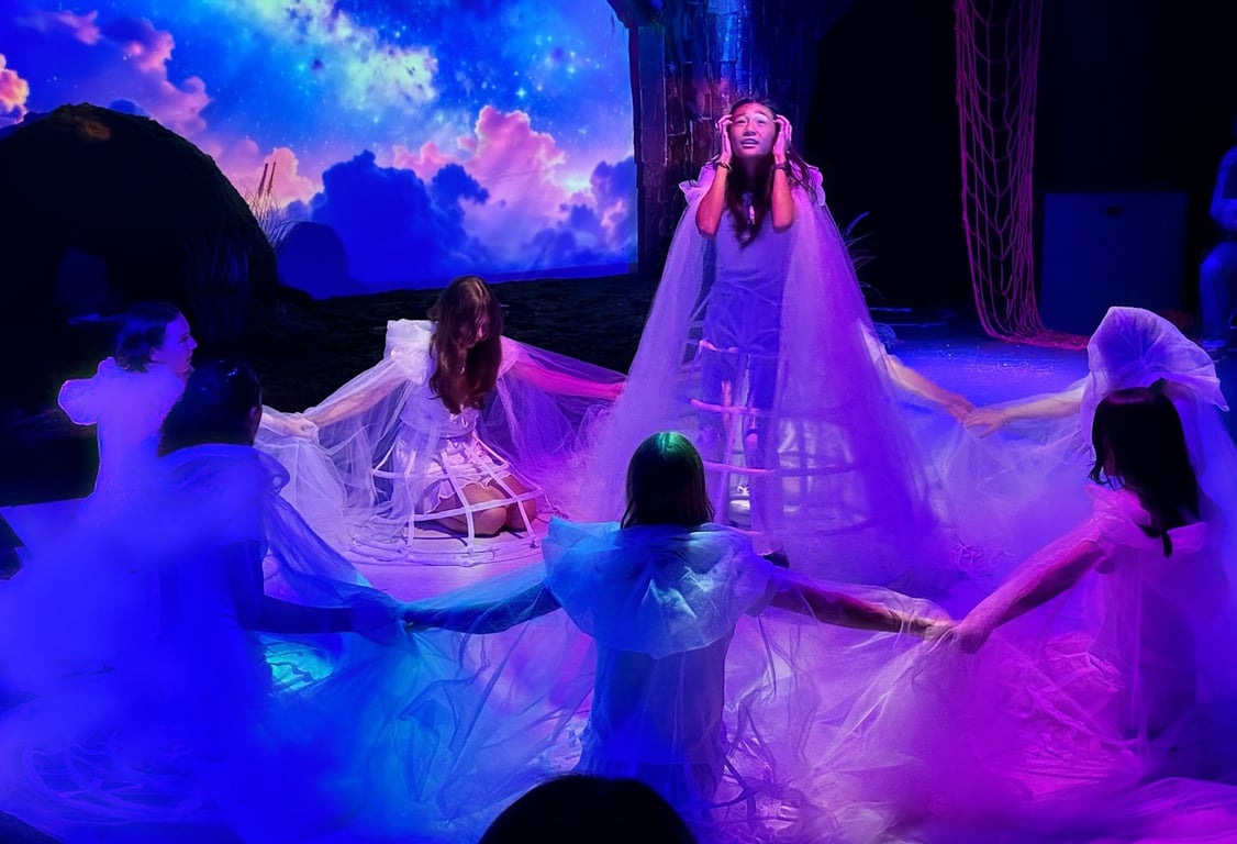Students performing in *Tectonic*, blending physical theatre with immersive multimedia storytelling.