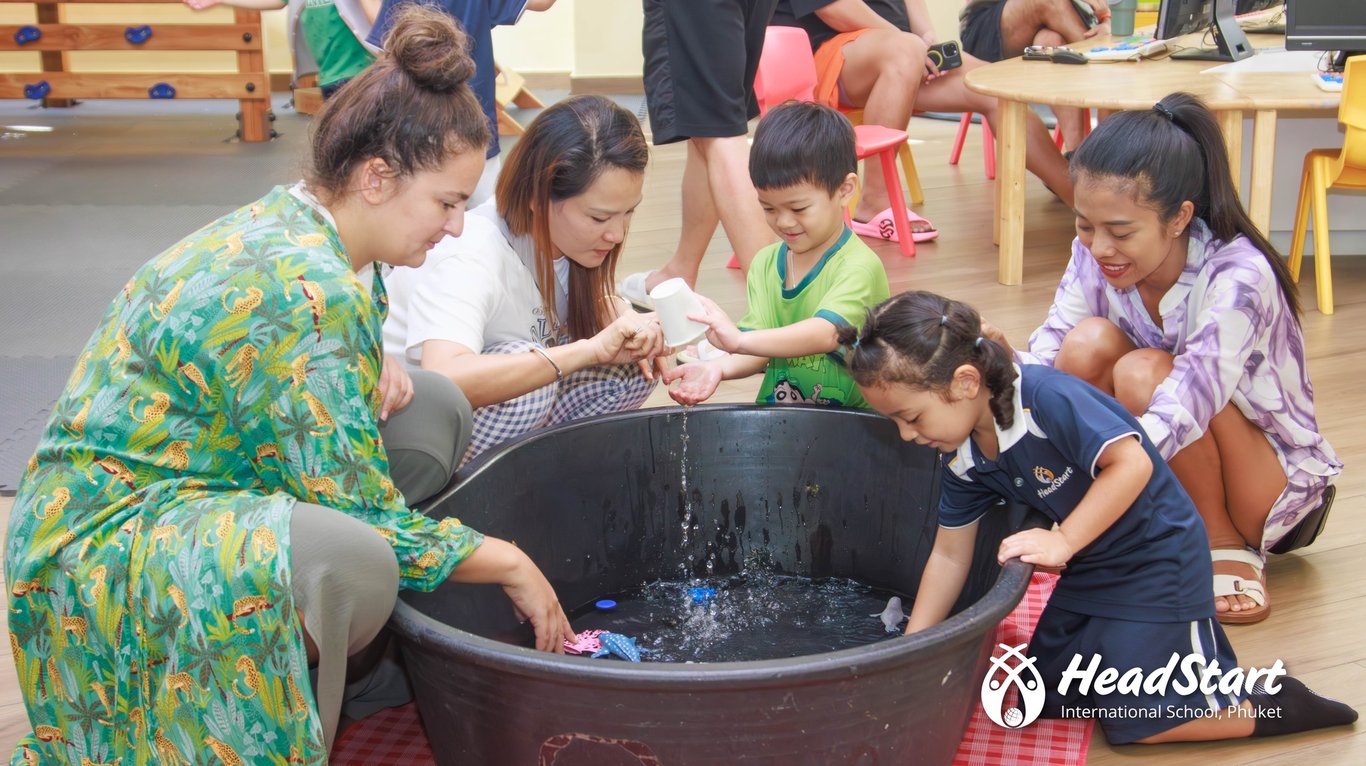 Parents and children explore water play during the ECO Stay & Play event.