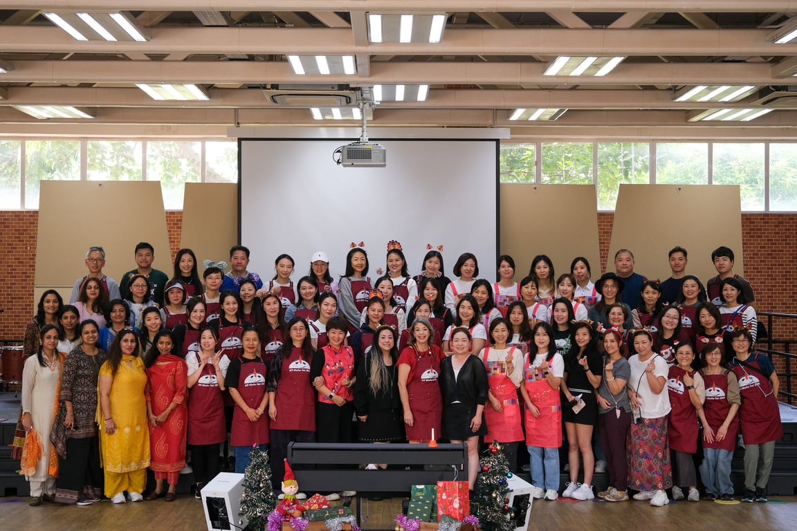 The AISHK community posing at the Winter event organised by the PTA.