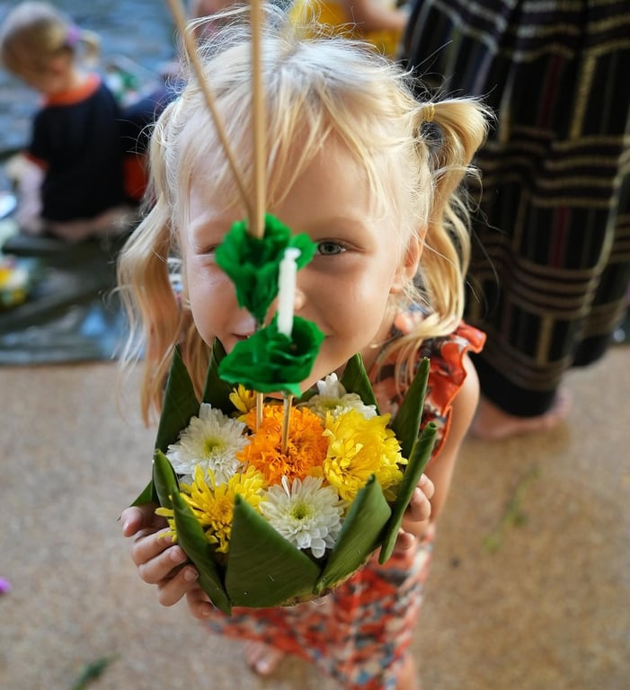 Loy Krathong celebration with students making traditional floating offerings.
