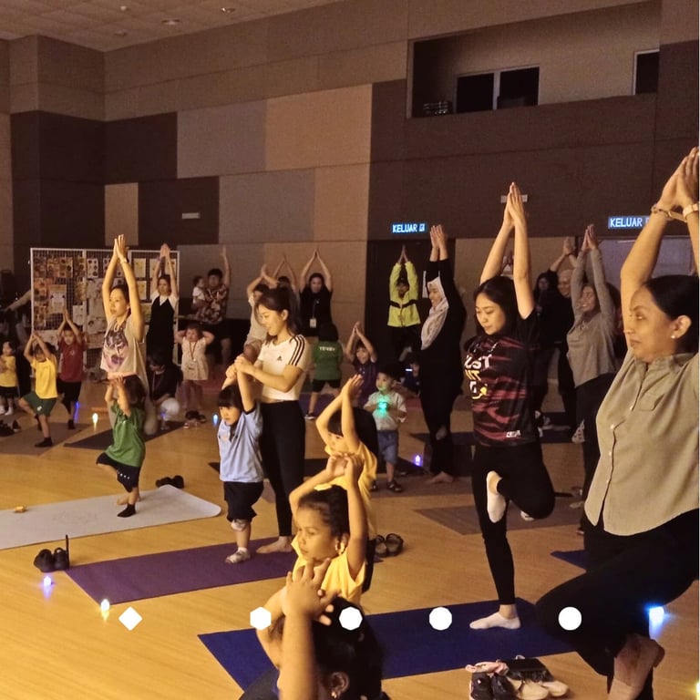 Early explorers sharing their yoga skills with parents. 