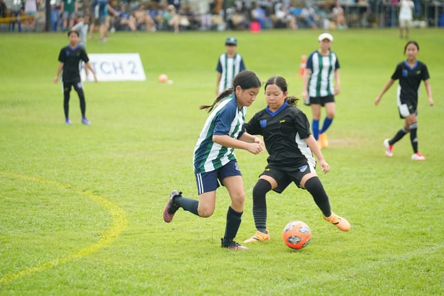 GV Panthers girls’ team competing in football at the FOBISIA Games.