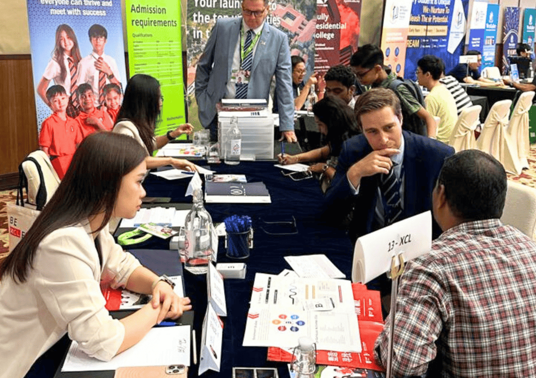 Prospective families being counselled in an education fair. 