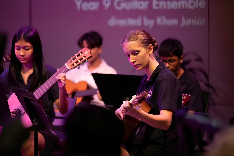 Year 9 guitar ensemble in full musical flow.