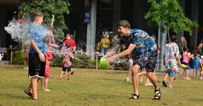 Children playing around at the Songkran festival.