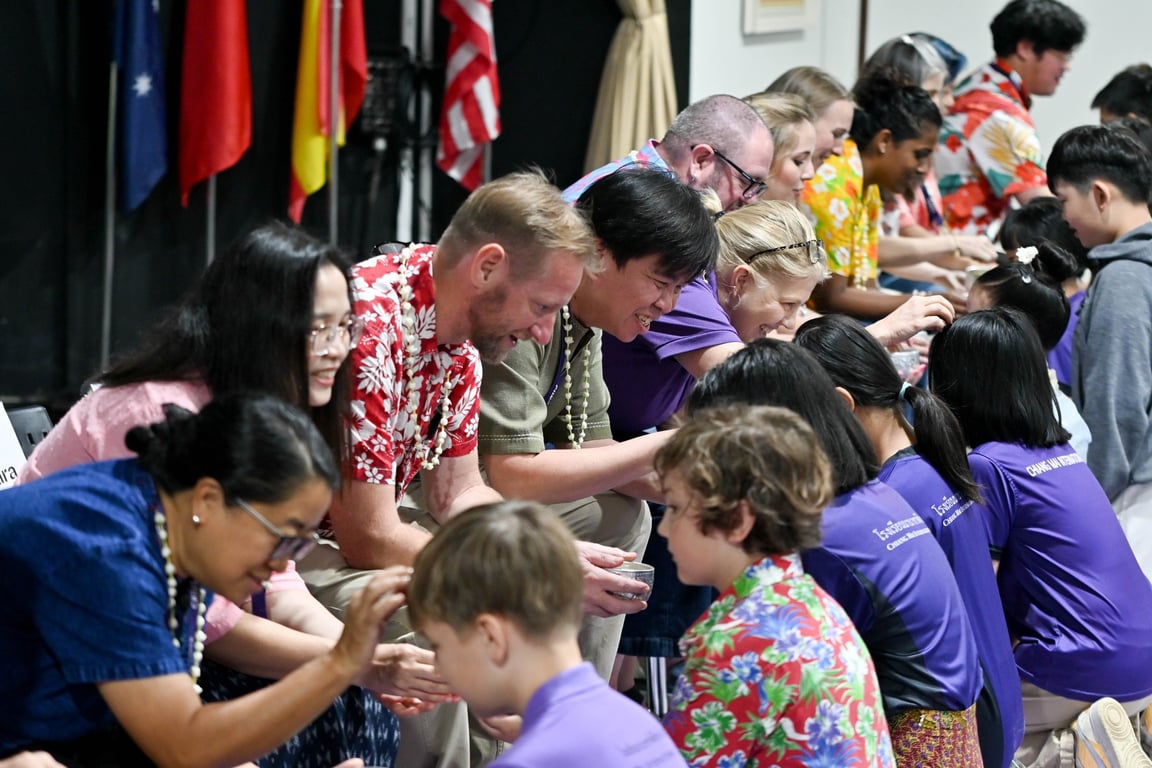 CMIS students taking part in a respectful Songkran tradition.