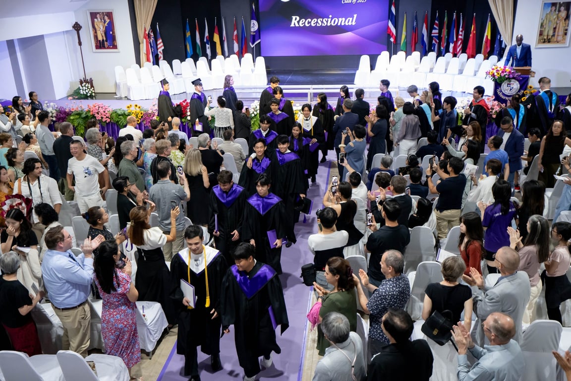 The school community cheering for the graduates.