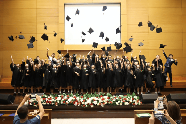 Seniors throw their caps to mark the end of high school.