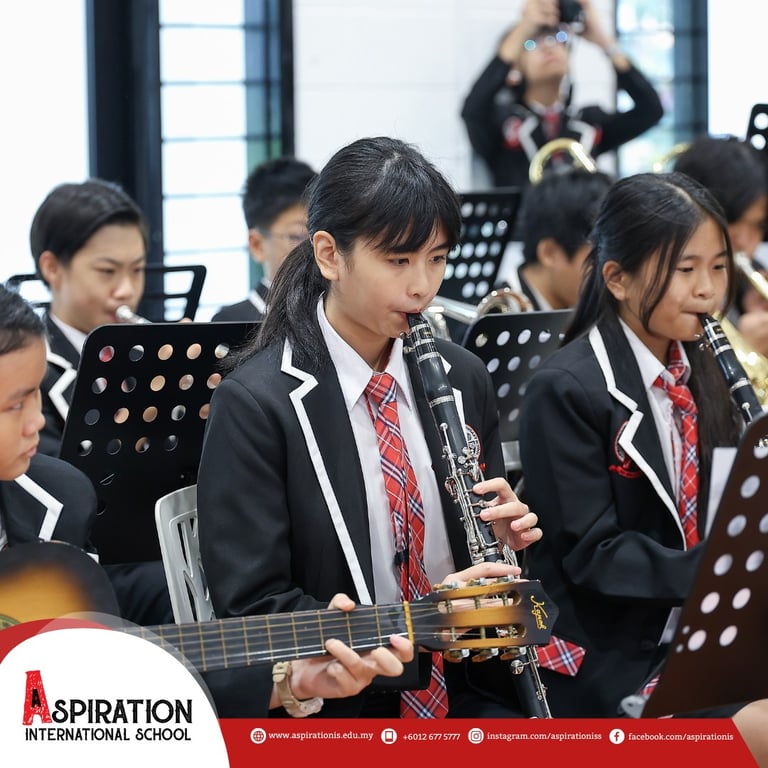 The student orchestra performs during an Open Day event on campus.