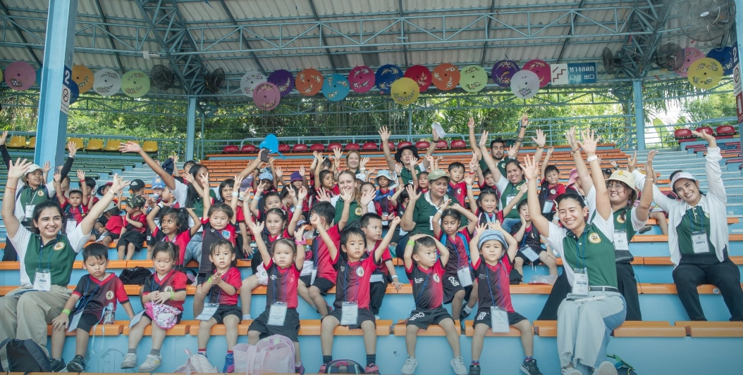 Students cheer together during a school sports event.