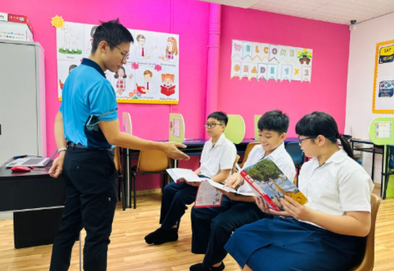 A teacher teaching the students in Bukit Gombok campus