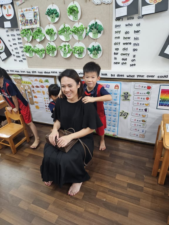 A student posing with his mother during the Mother's day celebrations.