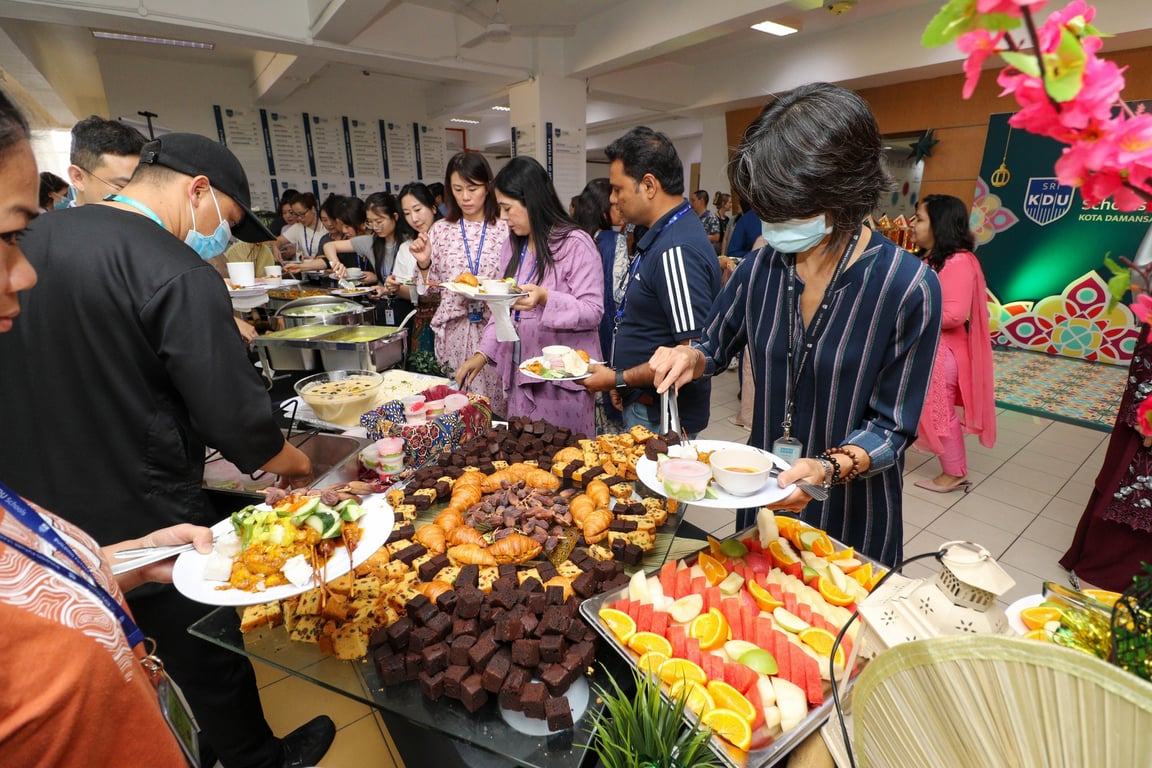 Families enjoy a night of celebration at the school during Hari Raya celebrations.