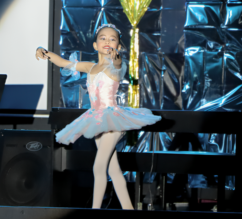 A ballet solo during the school’s talent show.