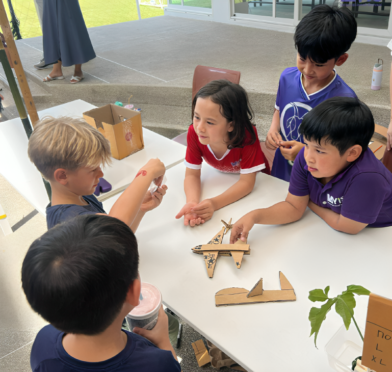 Young learners collaborate on creative, hands-on STEM projects.