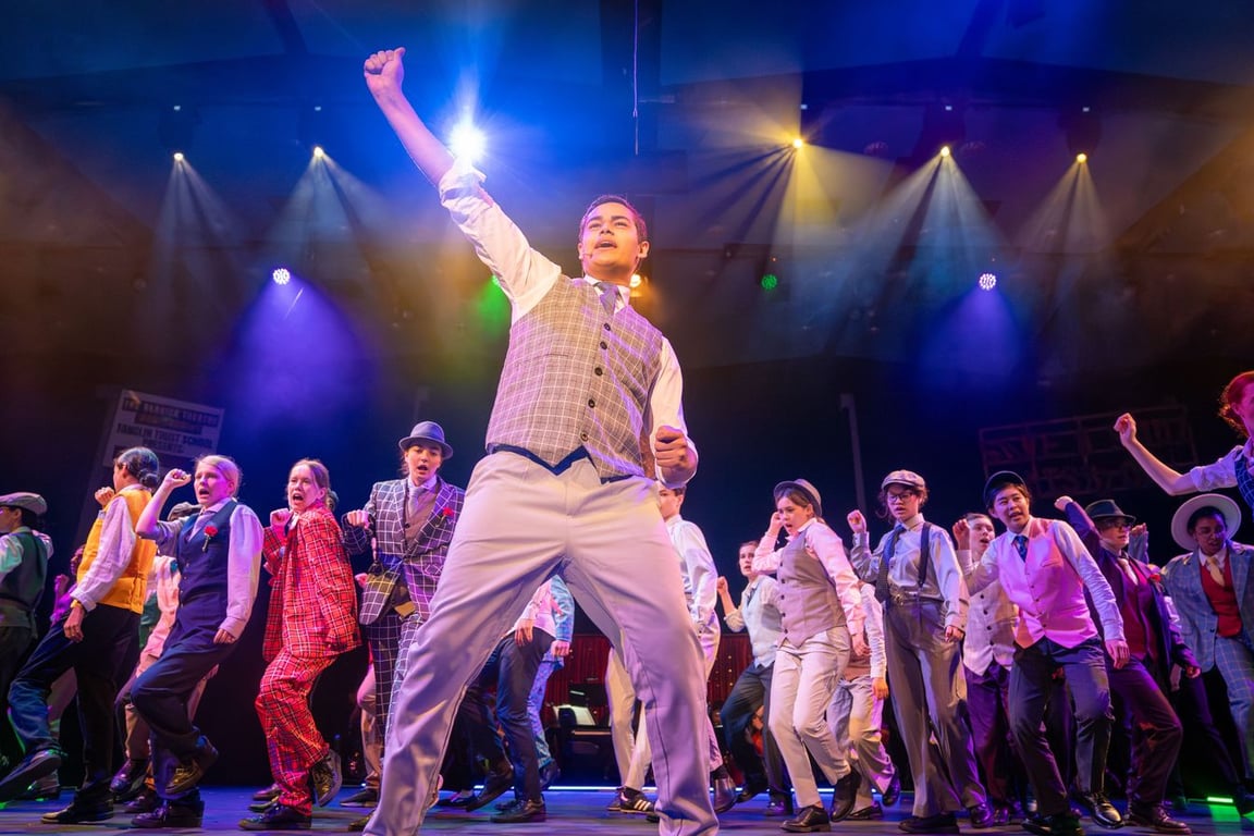 Senior students on stage performing the musical 'Guys and Dolls'