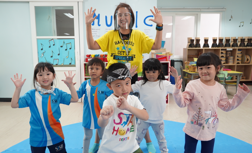 A happy moment from the school's music and movement session with their youngest learners.
