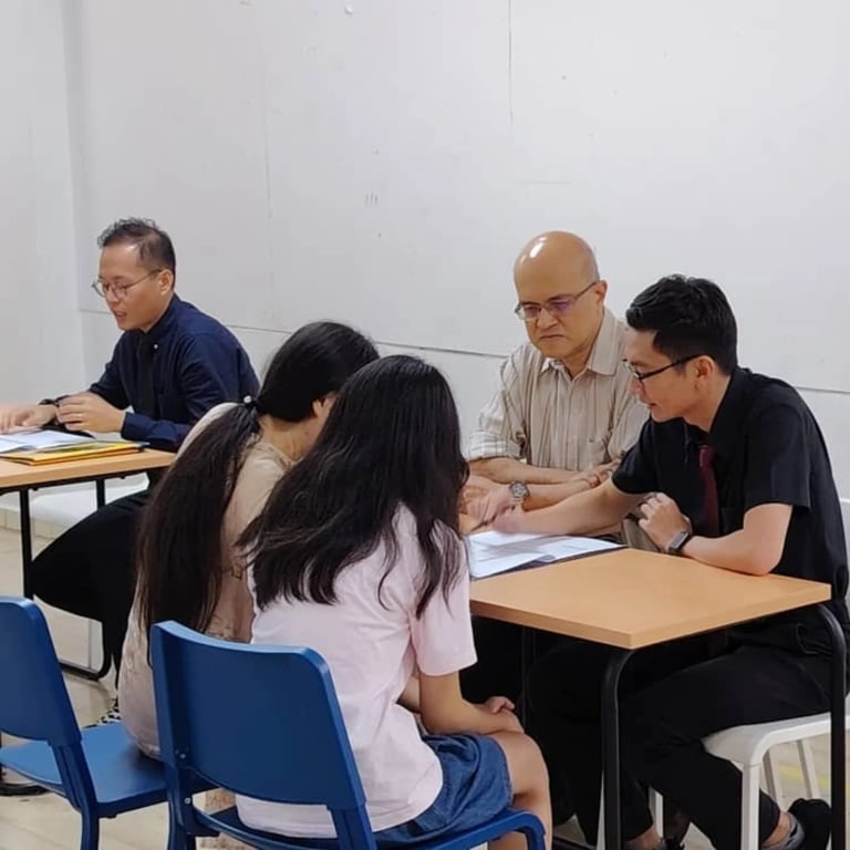 Families being counselled during parent-teacher meeting.