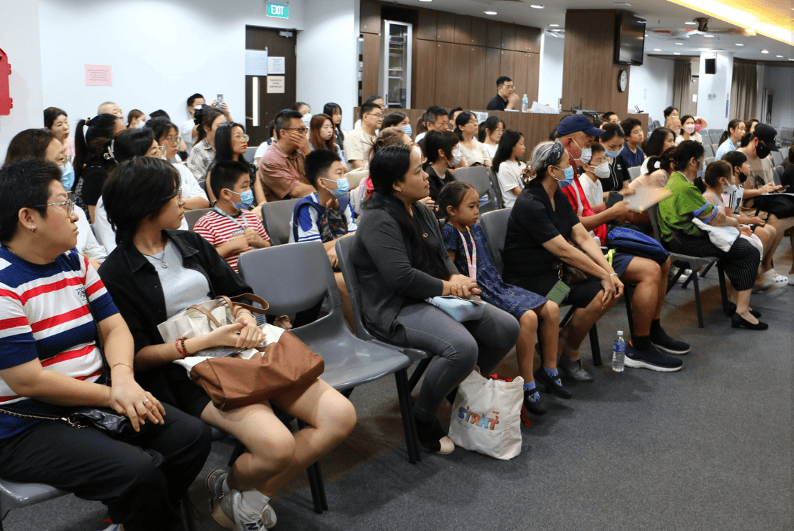 Children and their parents being welcomed for the new academic year.