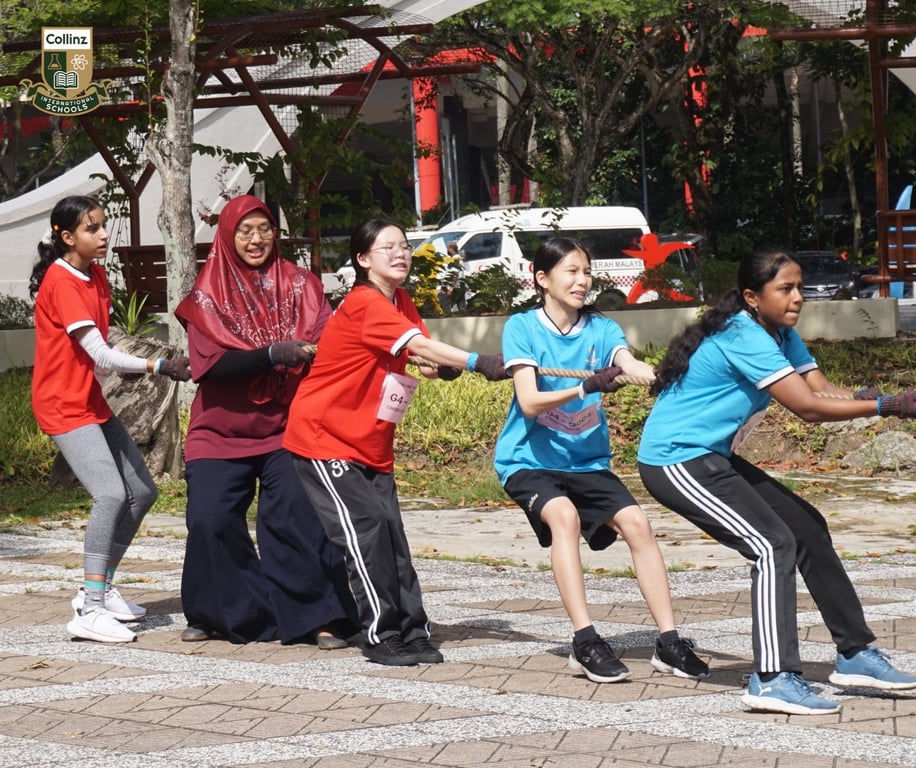 Students competing in a tug-of-war during cross-country day.