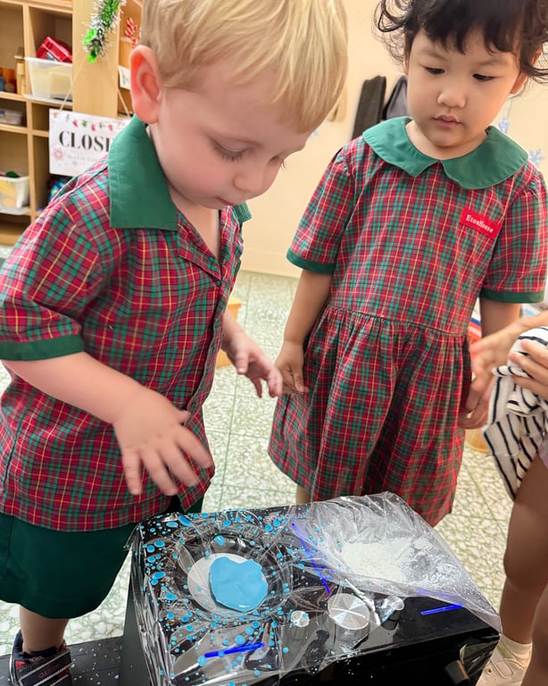 Students take part in a hands-on science experiment, in a lesson connecting art and science
