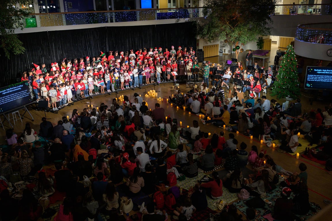 Families gathered for Carols by Candlelight with student performances.