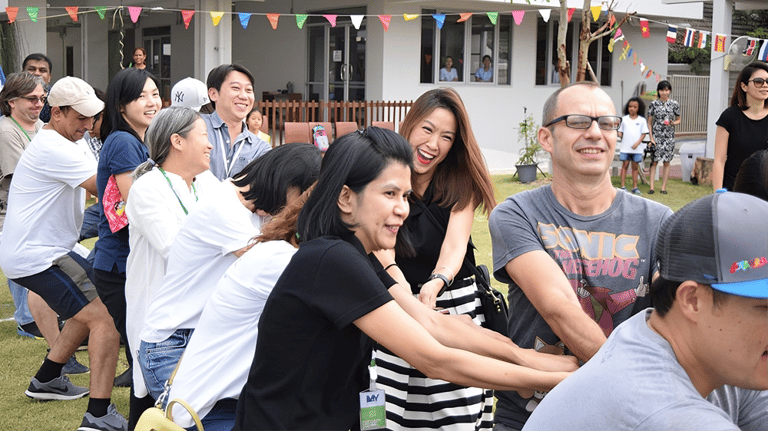 Parents and teachers bond through engaging school community activities.