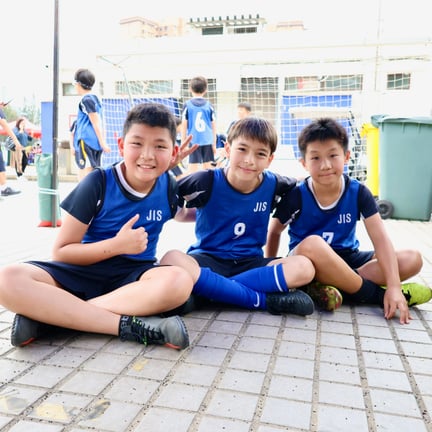 Boys’ rugby team celebrating after the HKSSF semi-final match.