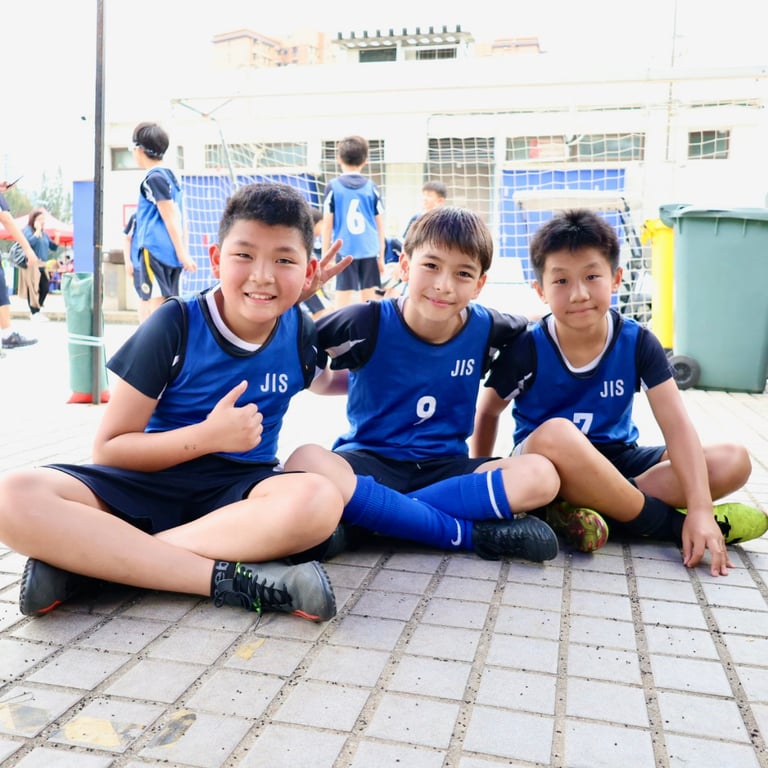 Boys’ rugby team celebrating after the HKSSF semi-final match.