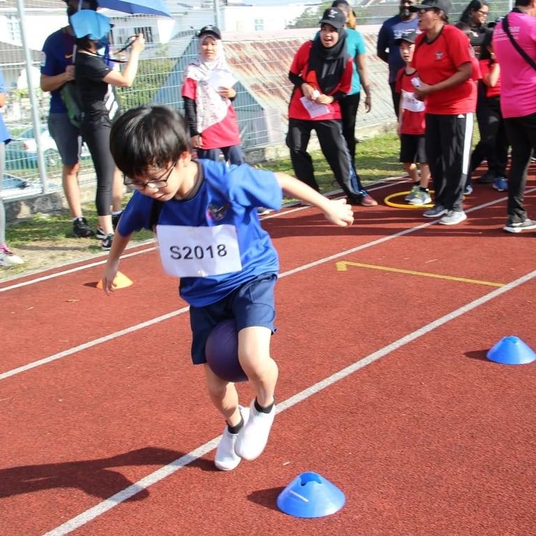 Parents watch on as the children compete in the Sports Day games.