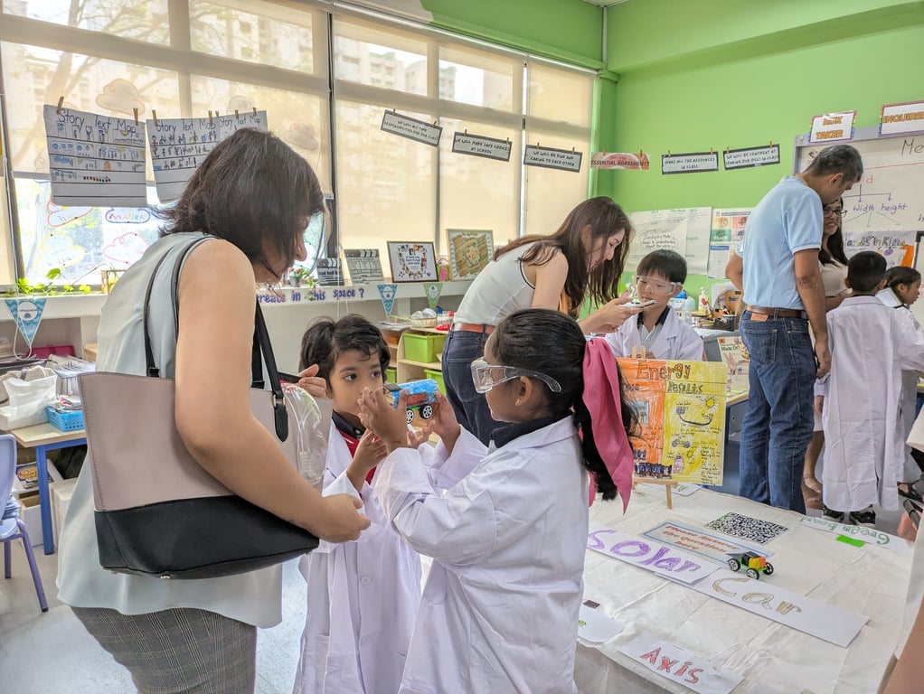Grade 1 students put on a science exhibition and showcase their investigations to parents.