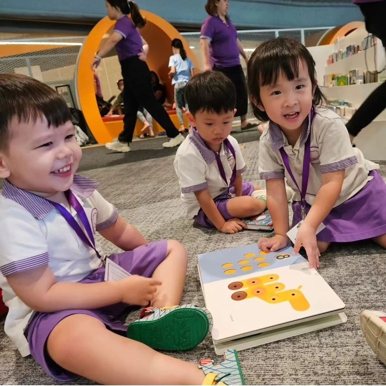 Children reading a story during their trip to the library