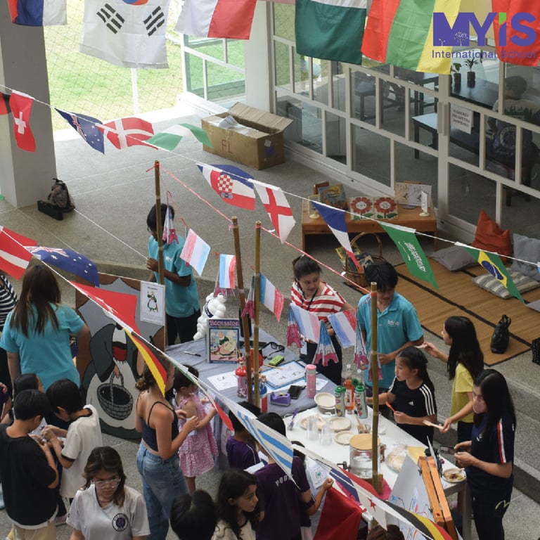MYIS families celebrating global diversity with hands-on cultural displays.