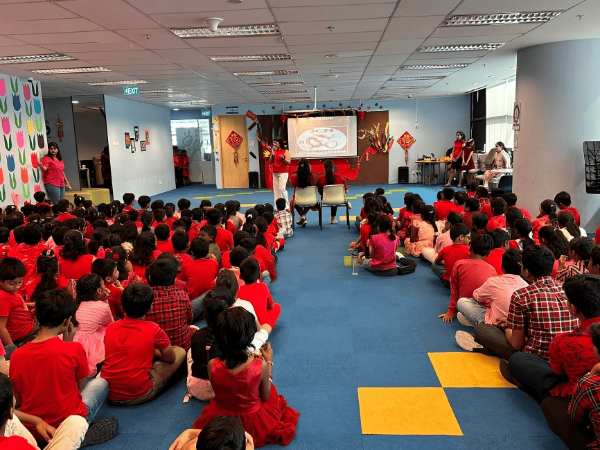 Students gather for a Lunar New Year assembly dressed in red for good luck.
