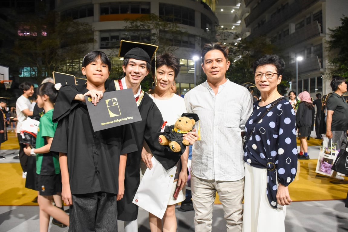 A family posing during a graduation ceremony.