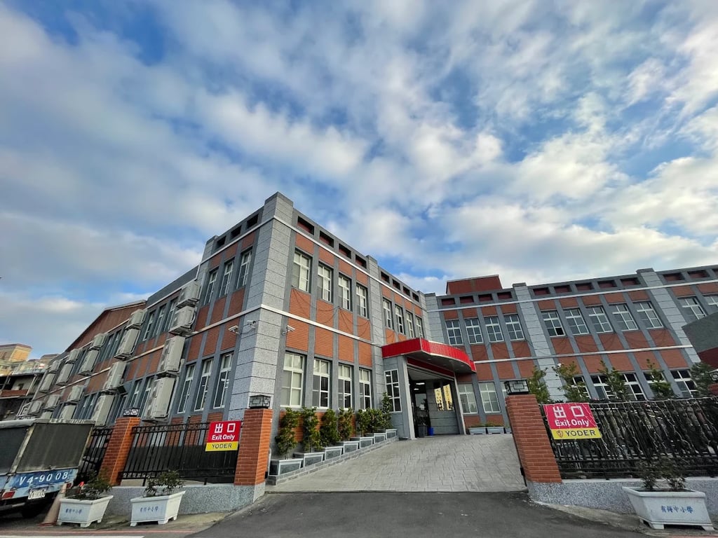 An exterior view of the Yoder International Academy campus building.