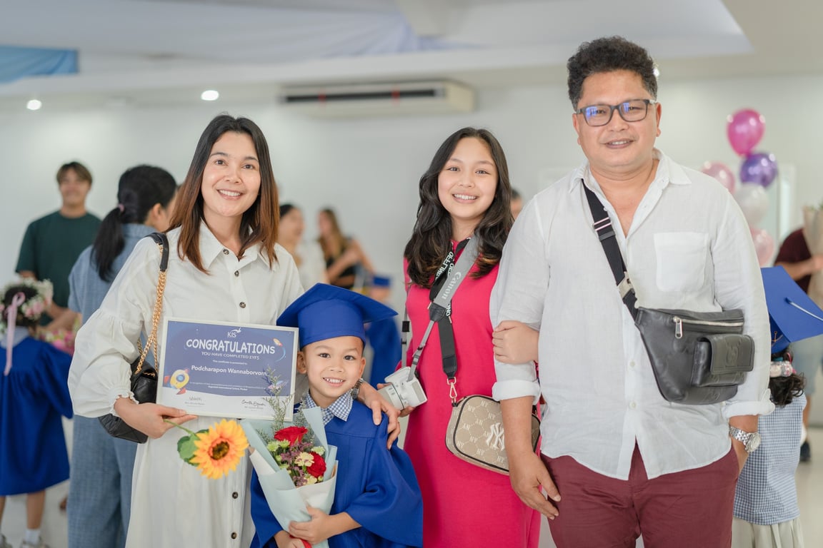 Family celebrates their child's EYFS graduation at KIS International School.