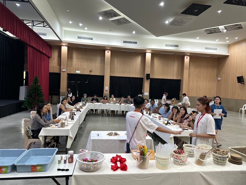 Parents participating in a holiday crafting workshop at LANNA International School.