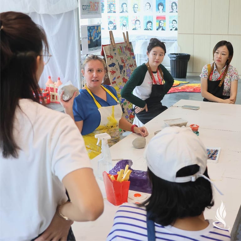 Parents attend the 'Arts in the PYP' session where they learn how art is integrated into the curriculum.